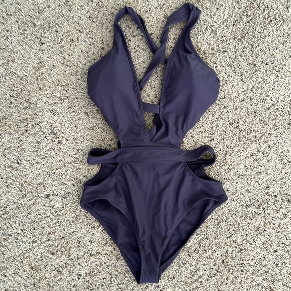 Brand new Xhilaration One Piece Swimsuit with cutouts. Size Medium.